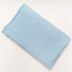 Coperta artigianale blu fatta a mano dalla Sartoria Sociale POPSart in tessuti morbidi e fantasiosi, unica e colorata, perfetta per divano o letto.